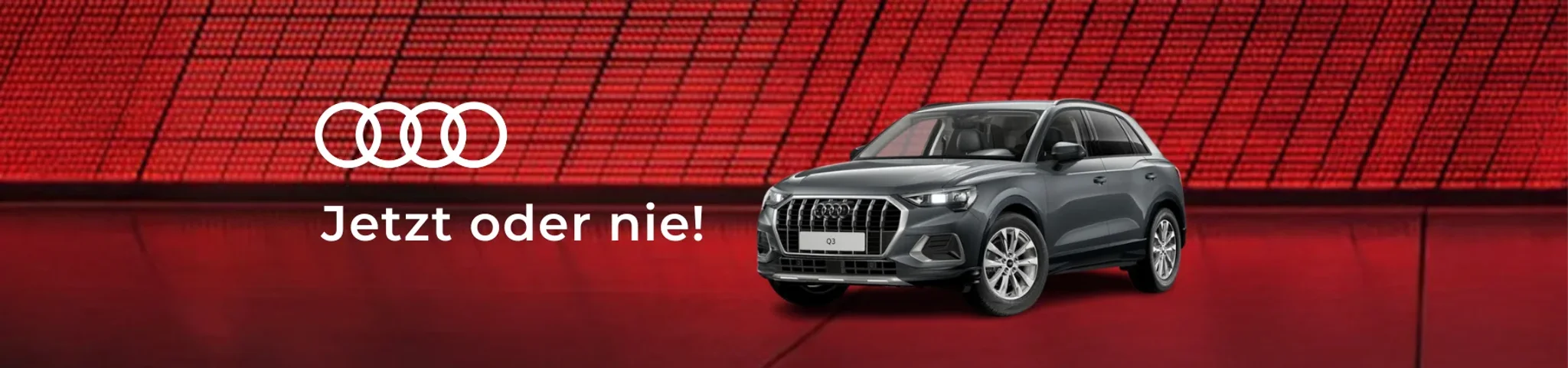 grauer audi q3 auf rotem hintergrund